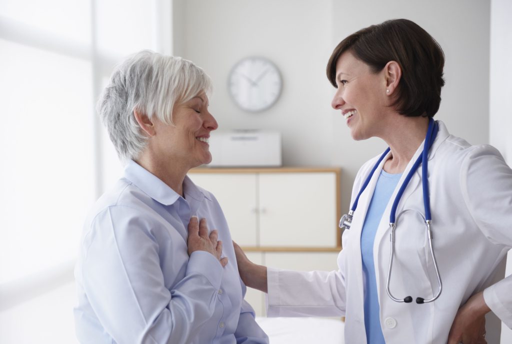 Doctor Reassuring Patient In Examination Room 89965040 E1749d2c1e7d428cb705151d7b4f58ce